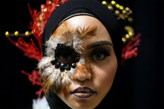 Make-up artists showcase peacock beauty in Malaysia
