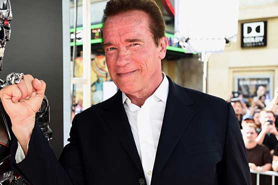 Schwarzenegger says you can have four Hummers and still save planet