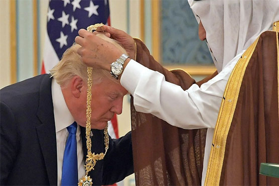 Trump slammed for 'bowing' to Saudi King
