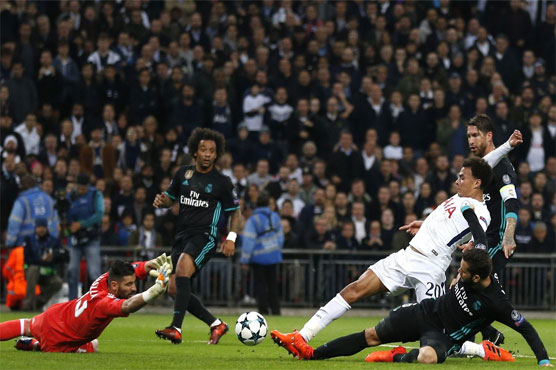 Football: Spurs stun Madrid, join Man City in last 16