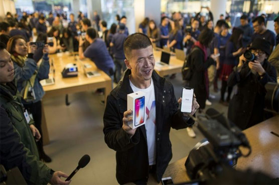 Apple's iPhone X hits Asia stores as profits soar