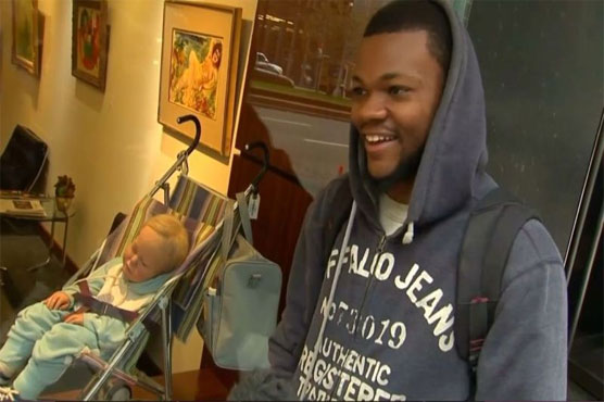 'That's art?' Baby turns heads in Manhattan auction house window