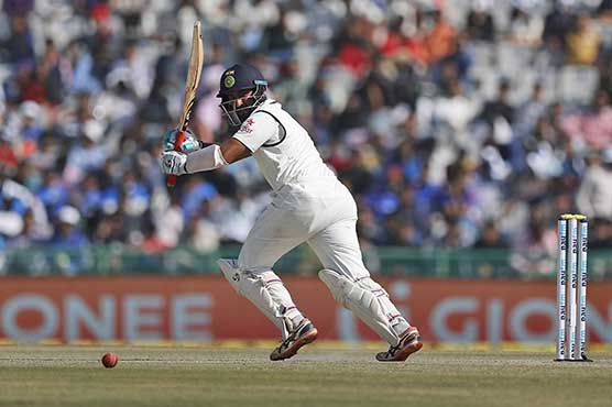 Pujara holds out as India struggle