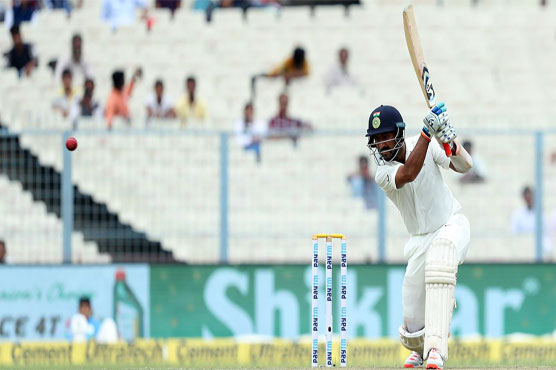 Pujara holds out as India struggle in rain-hit Test