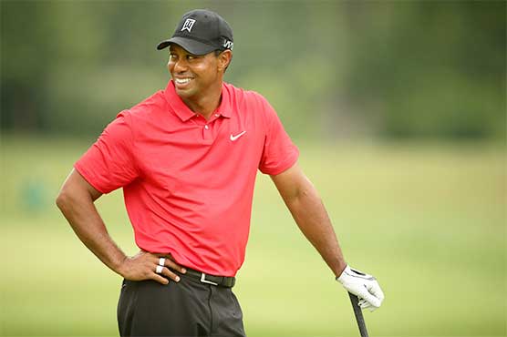 Golf: Woods 'loving life' after wrestling with pain