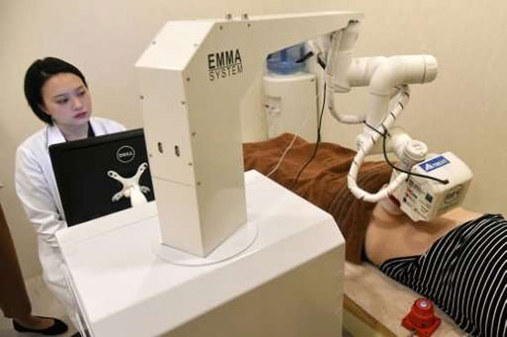 Emma the robot masseuse gets to work in Singapore