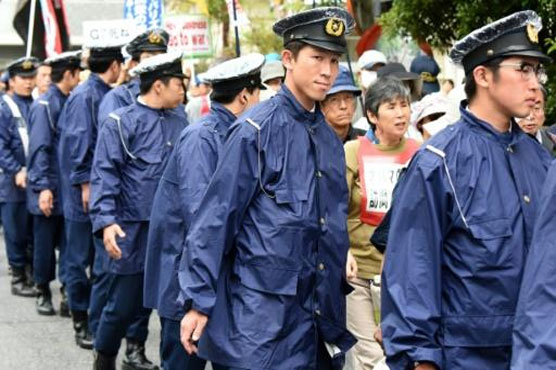 Japan man nabbed for trying to steal car...with cops inside