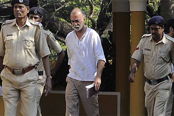 Indian court charges ex-editor with raping colleague