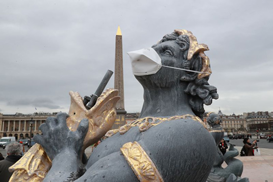 French statues get anti-pollution masks in clean air protest