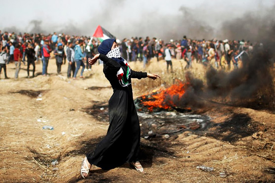 Thousands of Palestinians protest at Gaza-Israel border, one dead