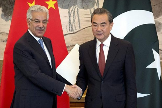 Khawaja Asif meets Chinese FM in Beijing