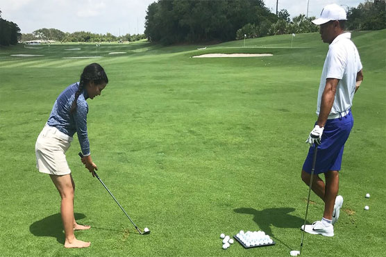 Nepali teen gets golf lesson from Woods