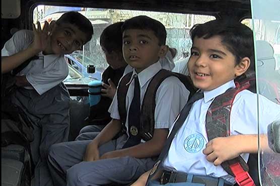 Children in Karachi make their way to schools