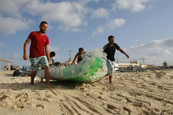 Gaza fisherman battles poverty with plastic bottle boat