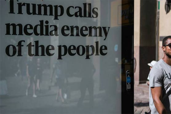 US newspapers hit back at Trump, defend free press