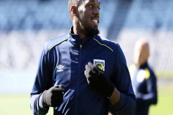 Bolt struggling with football pace, but working hard