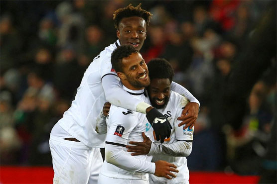 Swansea hit eight in FA Cup rout, Huddersfield advance