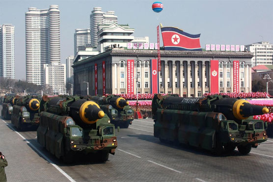 North Korea stages show of force with new missiles during parade