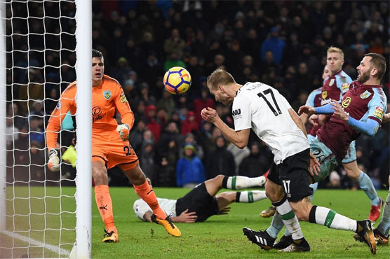Football: Klavan late show lifts Liverpool, Hughes under fire