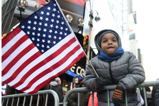Trump denies he's a racist as Americans honour King