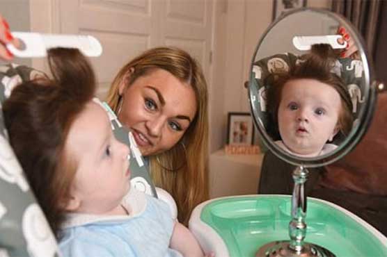 This baby's hair styling takes two hours
