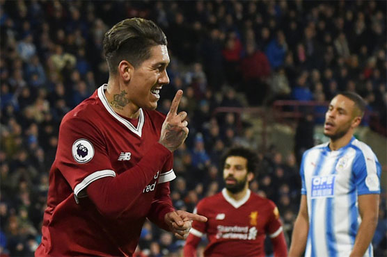 Rampant Liverpool swat aside Huddersfield