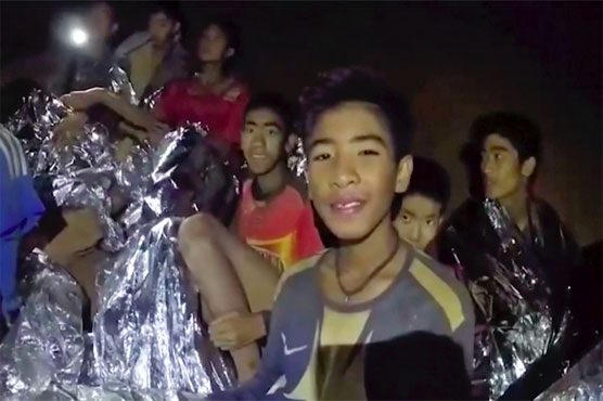 'Race against water' as rain threatens Thai boys in the cave