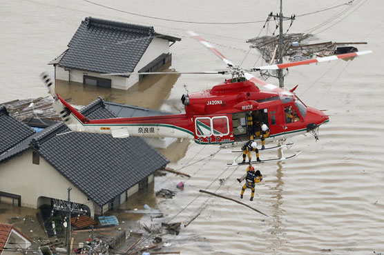 Desperate rescue efforts as Japan rains toll hits 75