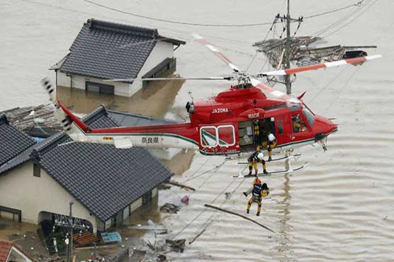 Japan PM cancels overseas trip as rain toll hits 100: local media