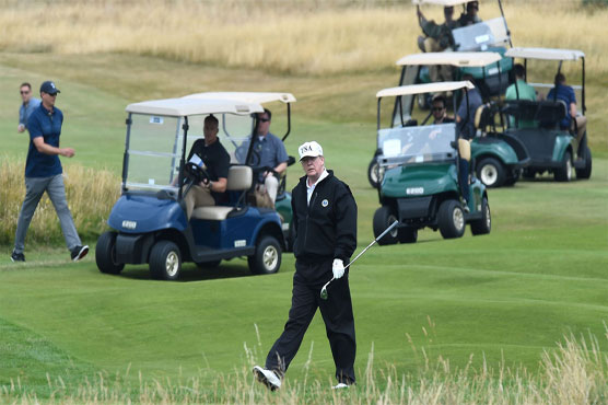 Trump on Scottish golf course as he tees up Putin talks