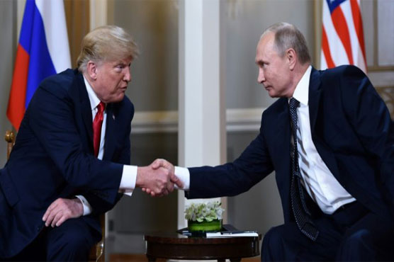 At summit, Trump refuses to confront Putin on vote row