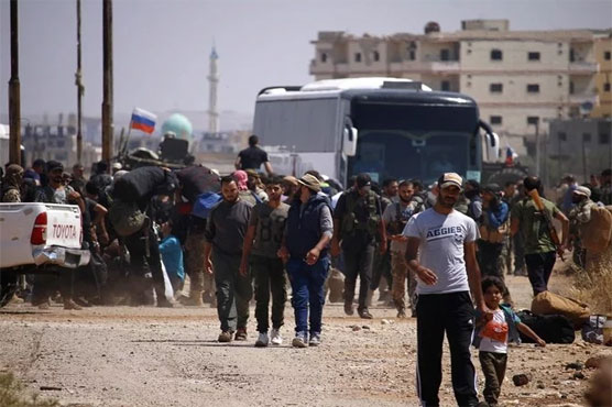 Buses arrive to ferry Syria rebels out of zone near Golan: monitor