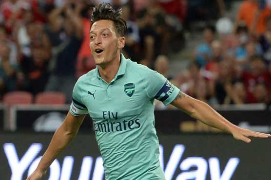 Race-row Ozil fires Arsenal to big win over PSG