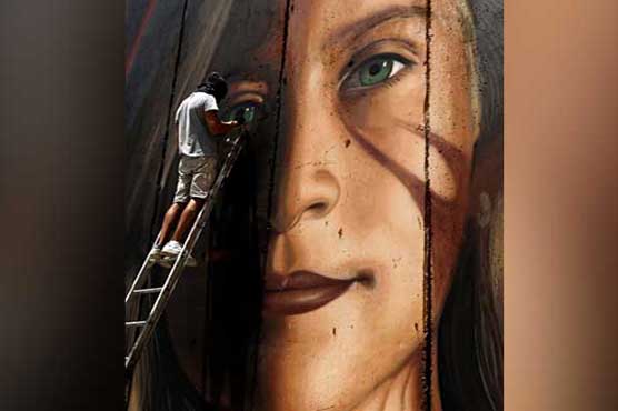 Israel arrests Italians who painted mural of Palestinian teen