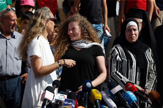Crowds greet Palestinian teen after release from Israeli prison