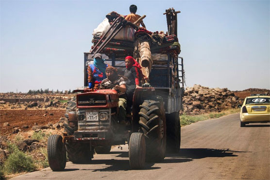 Families flee as Syria regime bombards southern city