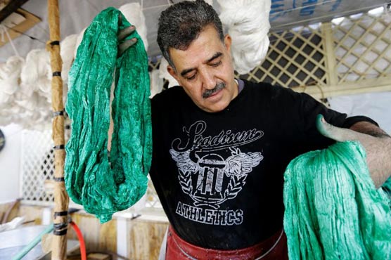 On a Damascus rooftop, tinting silk a fading craft