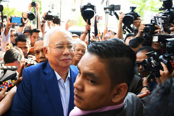 Malaysia's Najib quizzed over scandal, graft fighter reveals threats