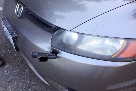 Handgun ends up in car's bumper
