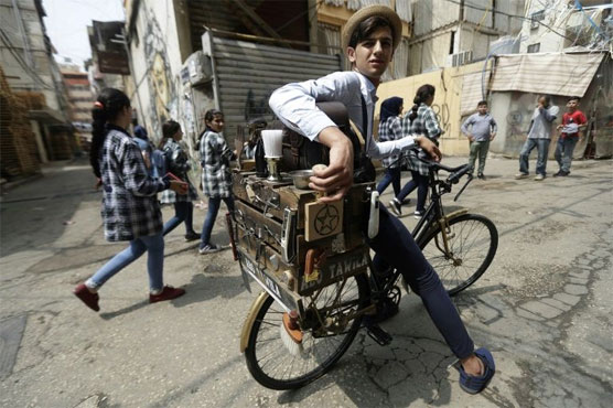 Beirut's dapper barber-on-a-bike offers curbside cuts