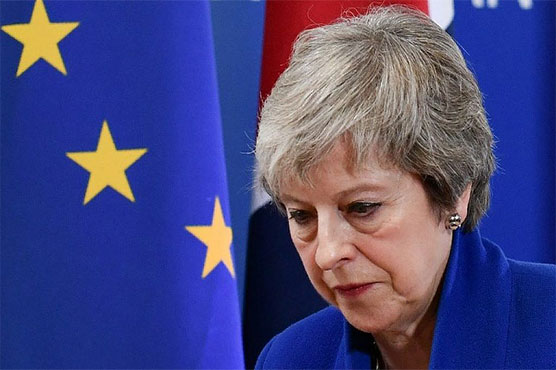 UK's May under assault over EU exit deal