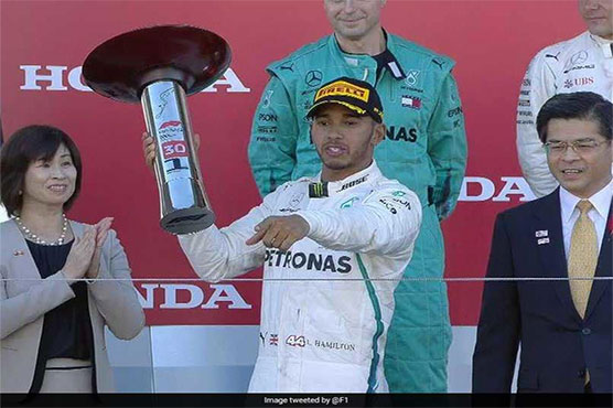 Hamilton storms to Japan win to close on world title