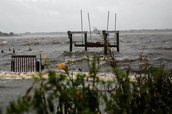 'Once in a lifetime' hurricane weakens, begins lashing eastern US