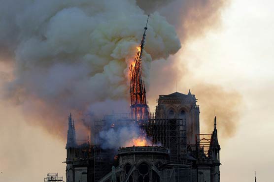 Notre-Dame fire under control, Macron vows to rebuild