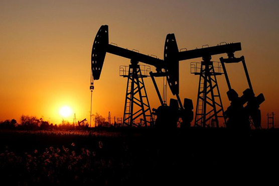 Oil prices edge down, pressured by U.S. supply