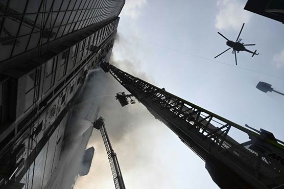 Bangladesh firefighters comb blaze-hit skyscraper
