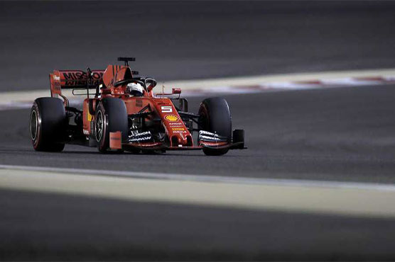 Defiant Vettel leads Ferrari domination