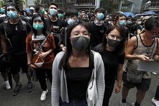 Hong Kong ban on masks sparks violent clashes, rail shutdown