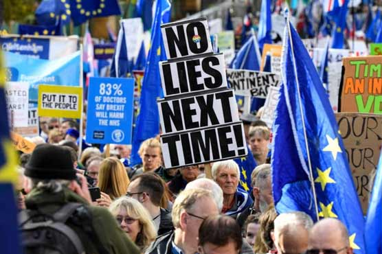 Anti-Brexit activists march to parliament as MPs debate deal