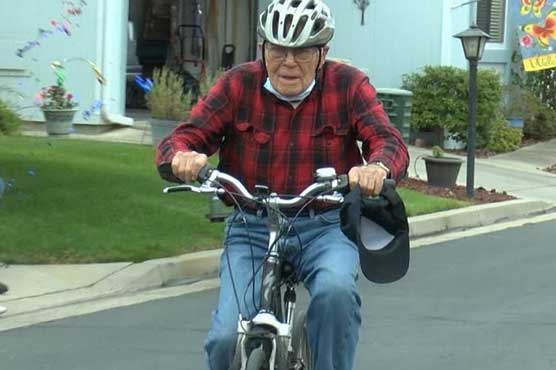 old man riding bike